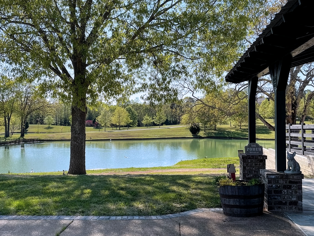 AKC French Bulldog Breeder TN Property The 185-acre property of Topdog French Bulldogs, a premier AKC French Bulldog breeder in TN, featuring a scenic pond and expansive grounds in Huron near Nashville and Memphis.